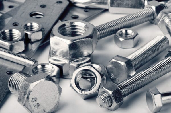 MRO items including nuts, bolts, and brackets managed by maintenance inventory management tools.