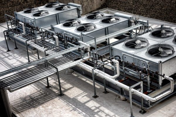 HVAC units with fans on the roof of a large building