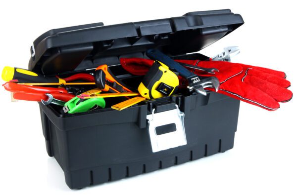 Black tool box with tools sticking out of it, representing the challenges of tool management.