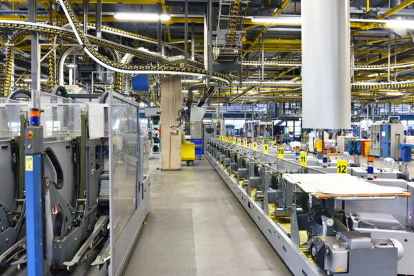 Production machines in a large print shop, numbered according to an asset naming convention.
