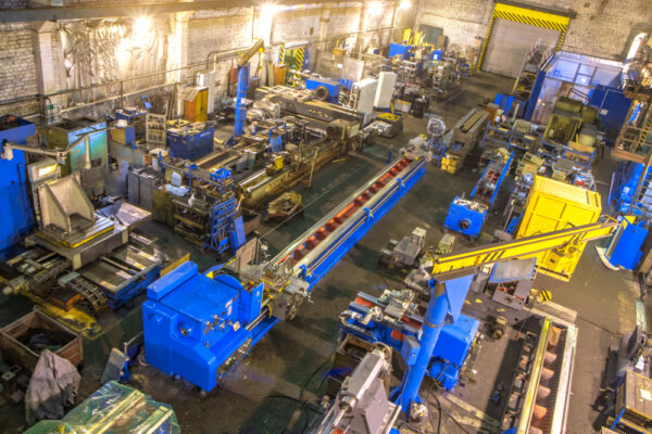 High-angle shot of industrial assets in a metalwork factory shop