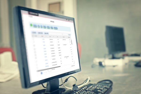 Medium shot of computer monitor with a CMMS displayed.