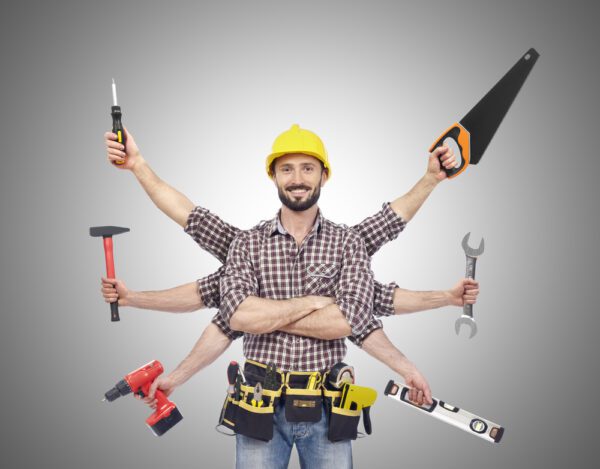 Medium shot of young male maintenance tech with 6 arms holding various hand tools.