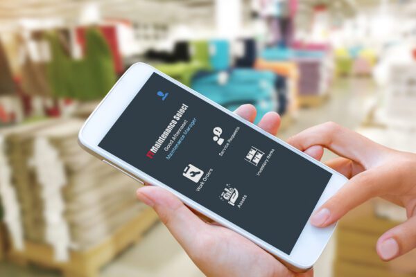 Close up of the FTMaintenance Select mobile CMMS app on a smartphone in a warehouse.