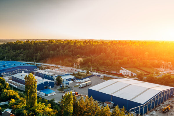 Aerial view of an industrial factory with multiple buildings.