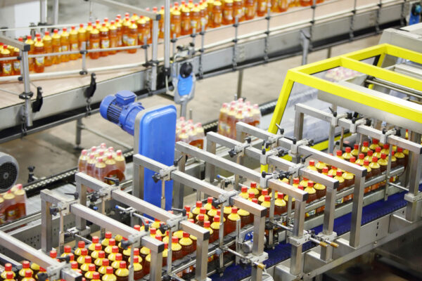 Top view of a bottling line in a beverage manufacturer facility running to specification.
