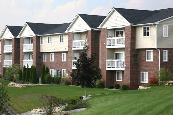 Suburban apartment complex on a grassy hill